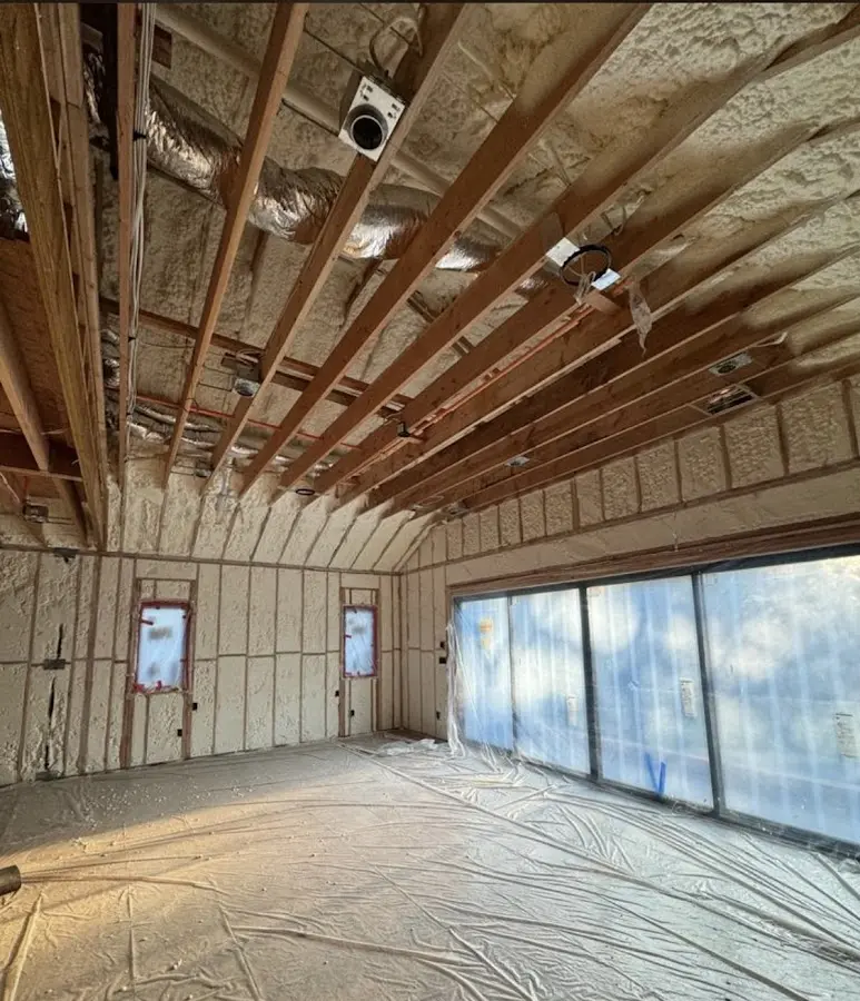 Interior walls and ceiling insulated with spray foam during new construction in Gloversville